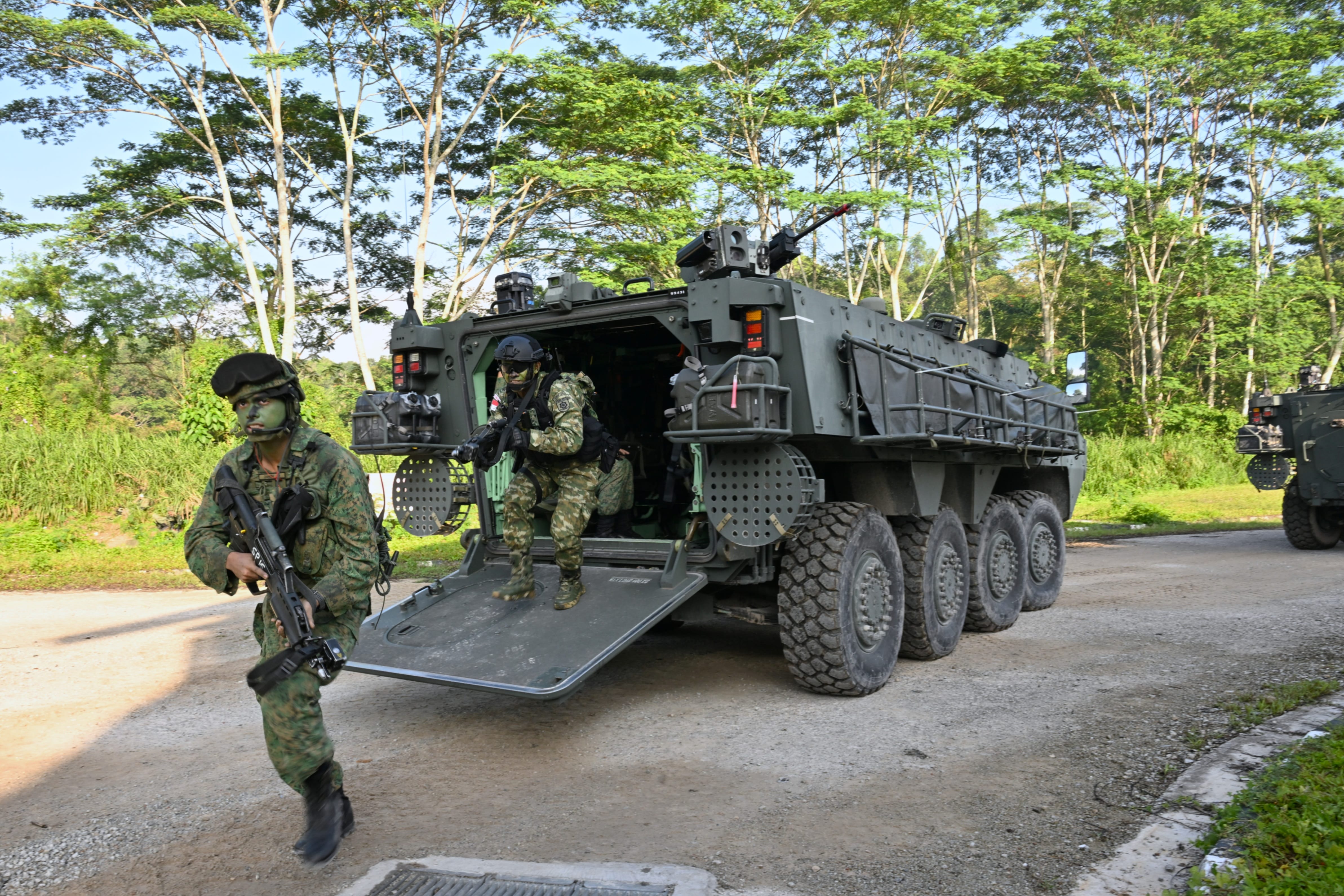 Soldiers from the Singapore Army and the TNI-AD dismounting from a Terrex Infantry Carrier Vehicle during the Combined..